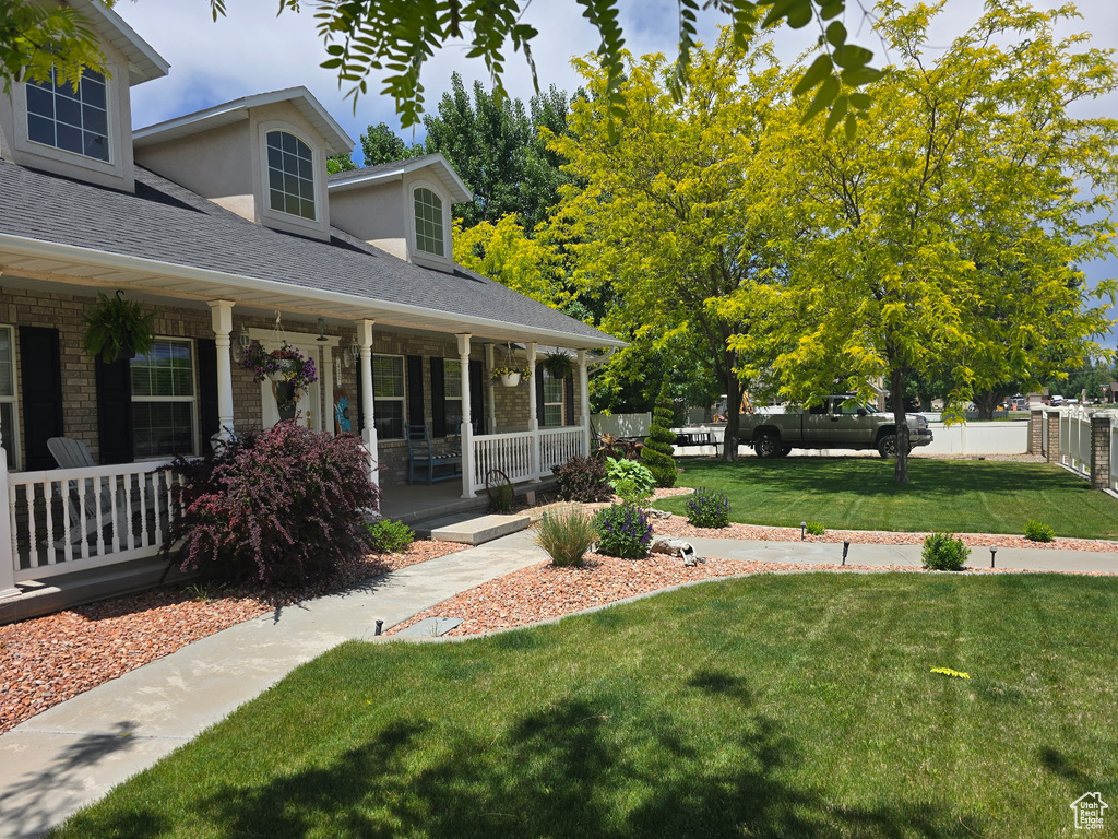 View of yard with covered porch