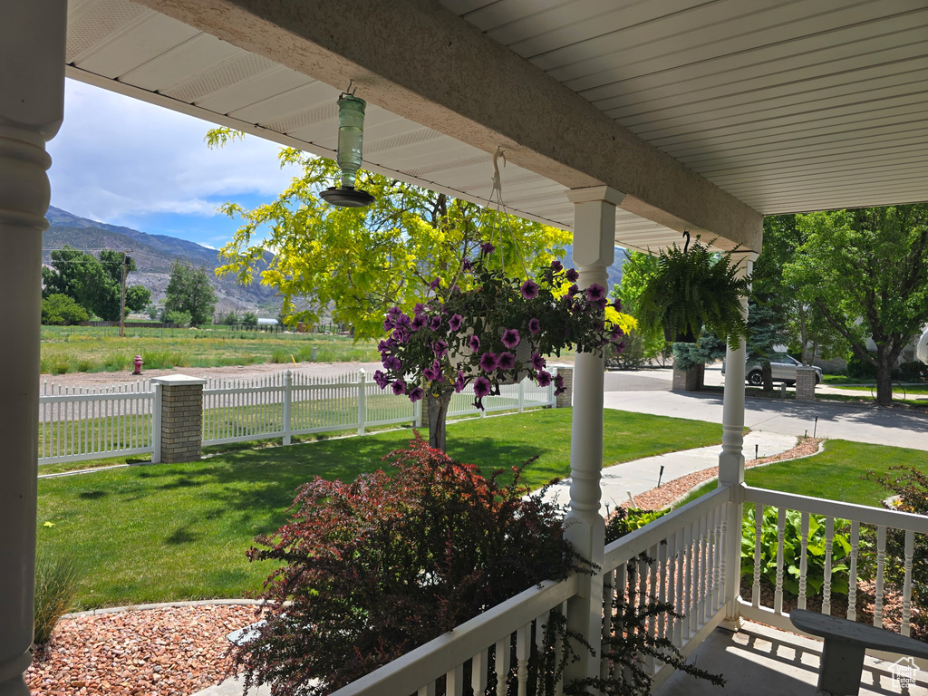 Covered porch with a mountain view