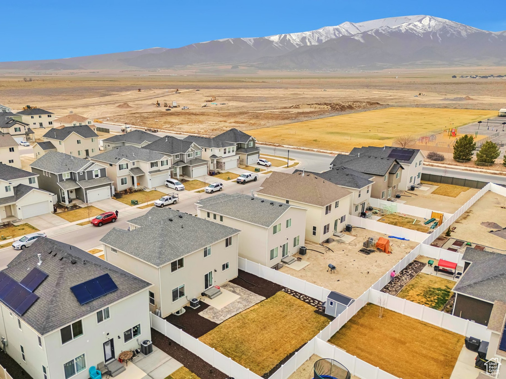 Drone / aerial view featuring a mountain view and a residential view