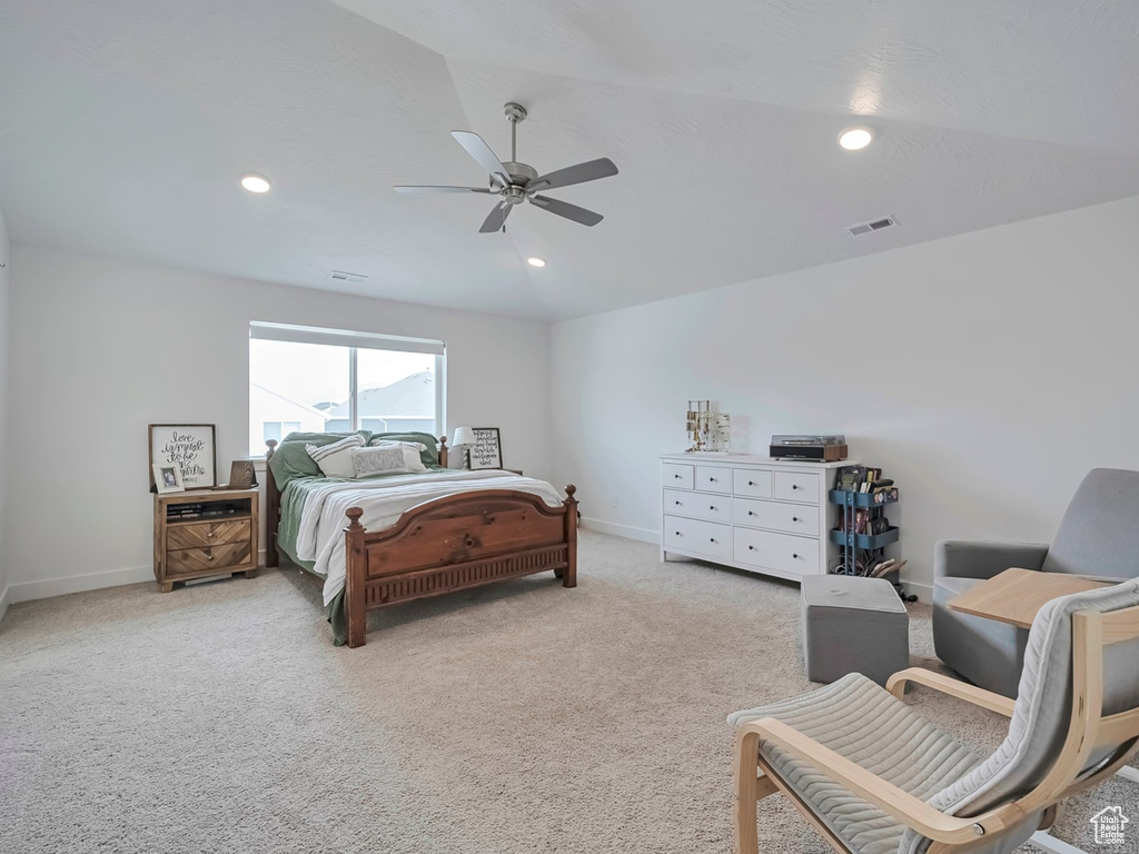 Bedroom with baseboards, ceiling fan, visible vents, and light carpet
