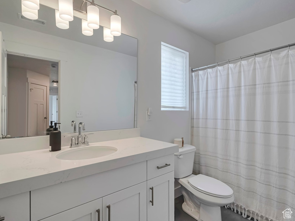 Bathroom with toilet and vanity