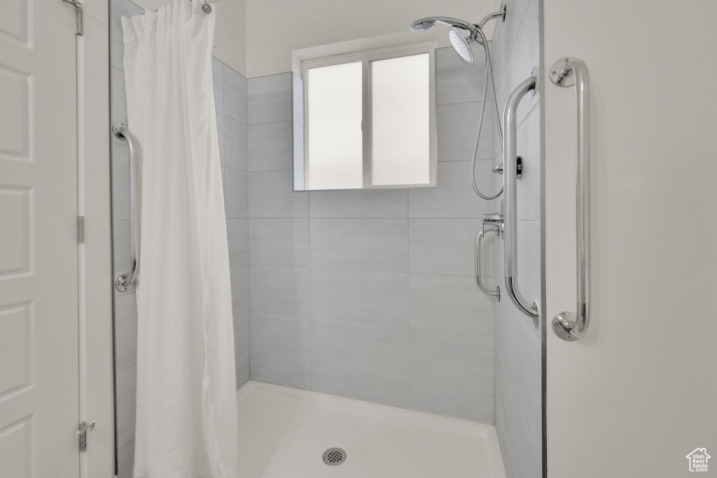 Full bath featuring a stall shower