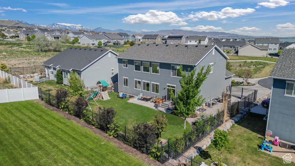 Aerial view featuring a mountain view and a residential view
