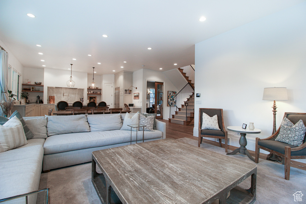Living area with stairs and recessed lighting