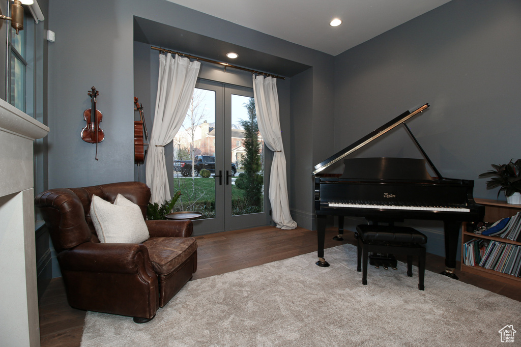 Sitting room featuring french doors, wood finished floors, and recessed lighting