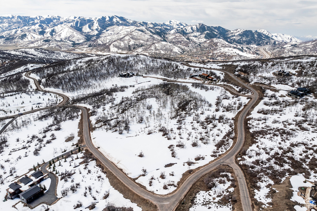 Snowy aerial view featuring a mountain view