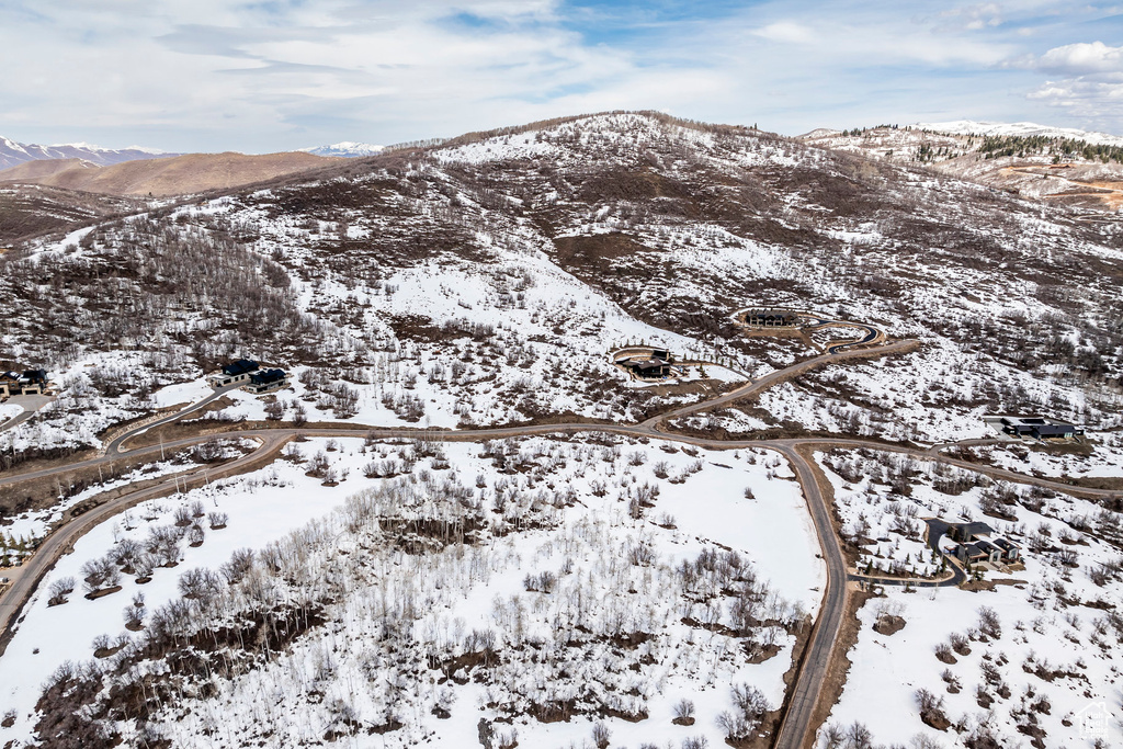 Snowy aerial view featuring a mountain view