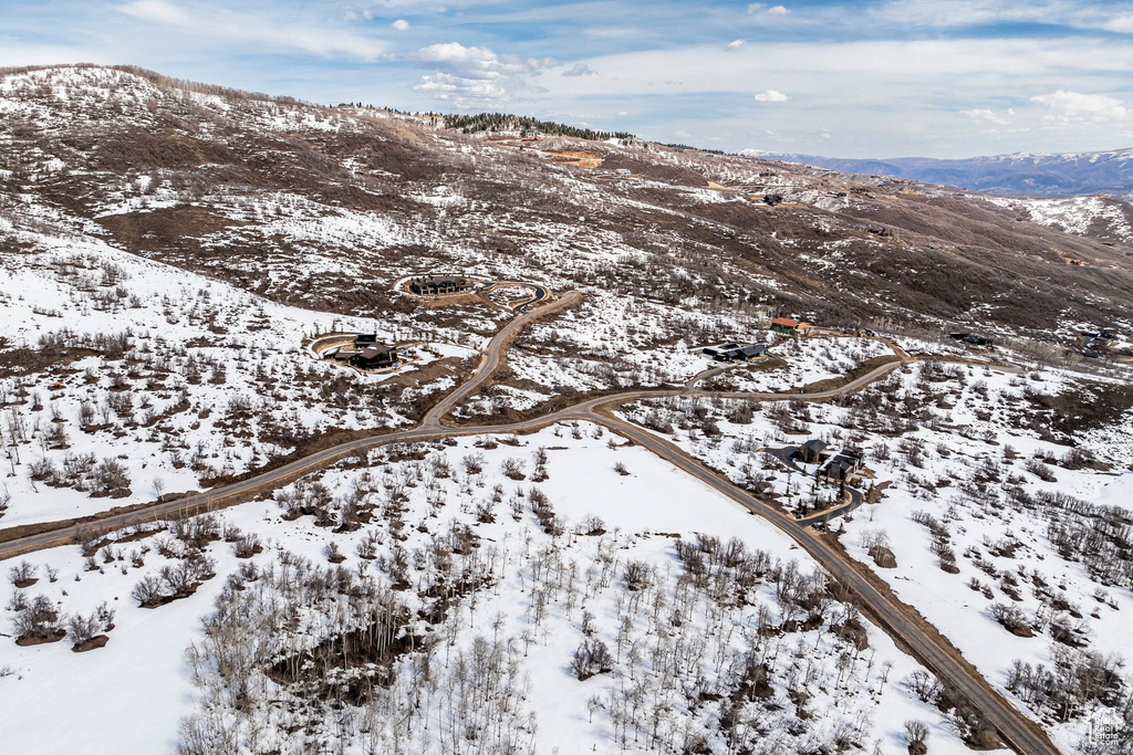 Snowy aerial view featuring a mountain view