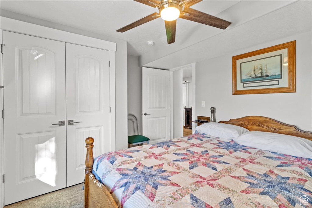 Bedroom featuring a closet and a ceiling fan
