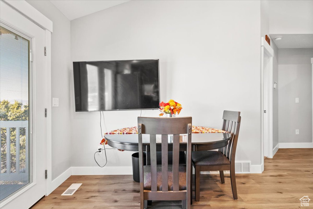 Dining space featuring wood finished floors and baseboards