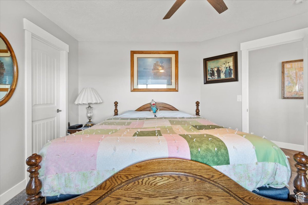 Bedroom featuring baseboards and a ceiling fan