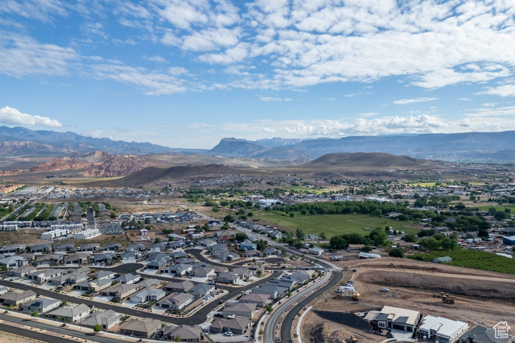 Aerial perspective of suburban area with a mountainous background