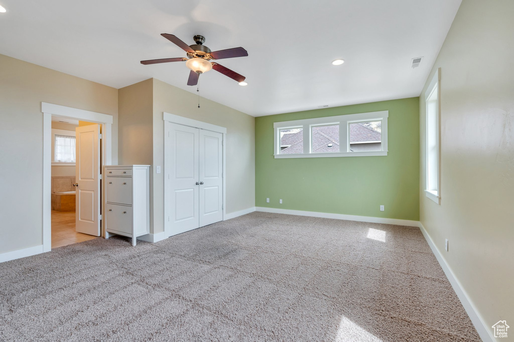 Unfurnished bedroom featuring a closet, visible vents, baseboards, recessed lighting, and carpet floors