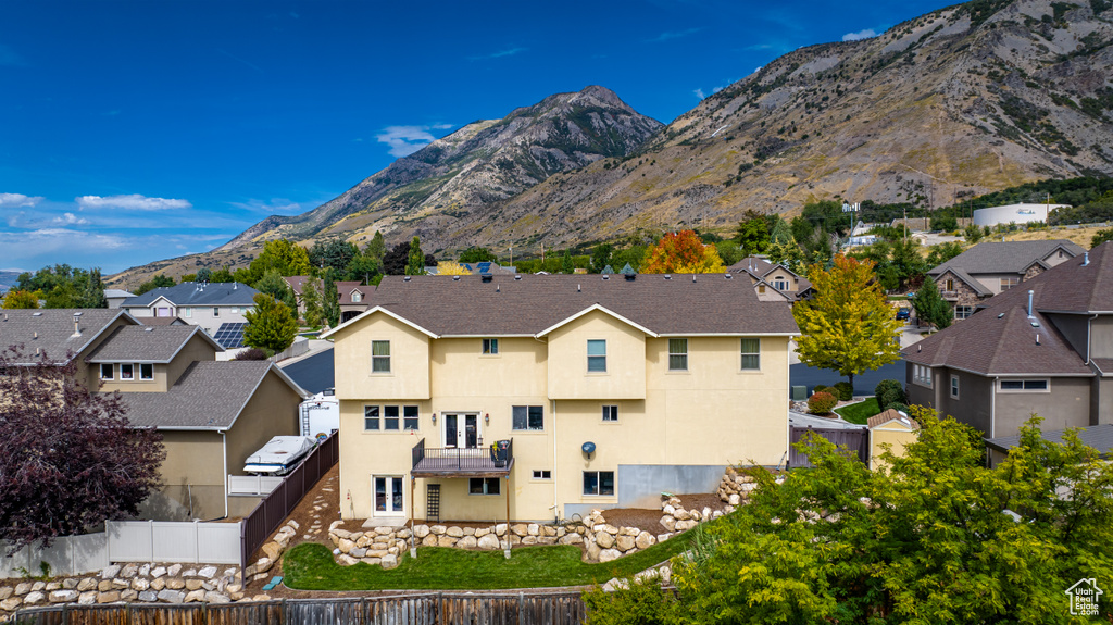 Property view of mountains with a residential view