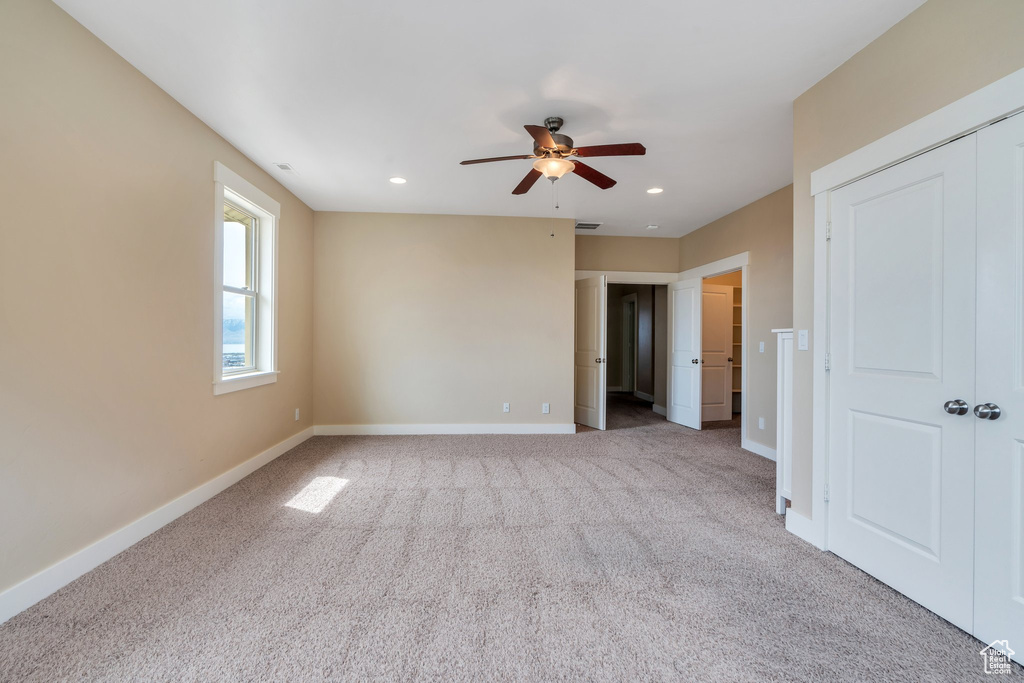 Unfurnished bedroom with carpet floors, baseboards, ceiling fan, and recessed lighting