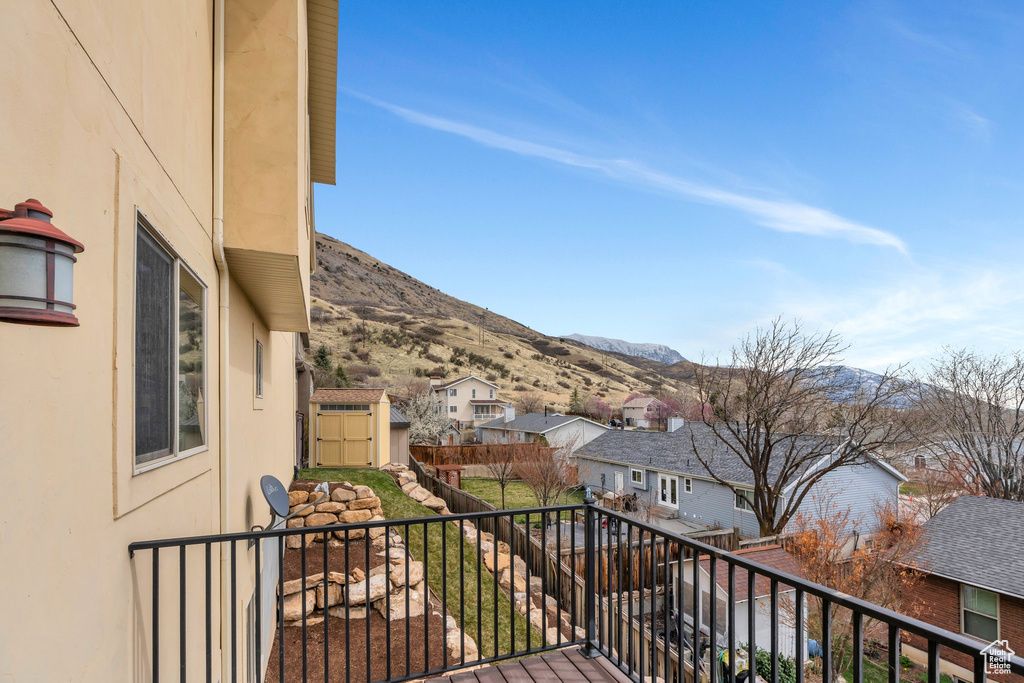 Balcony with a residential view and a mountain view