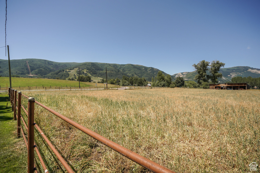 Property view of mountains with a rural view
