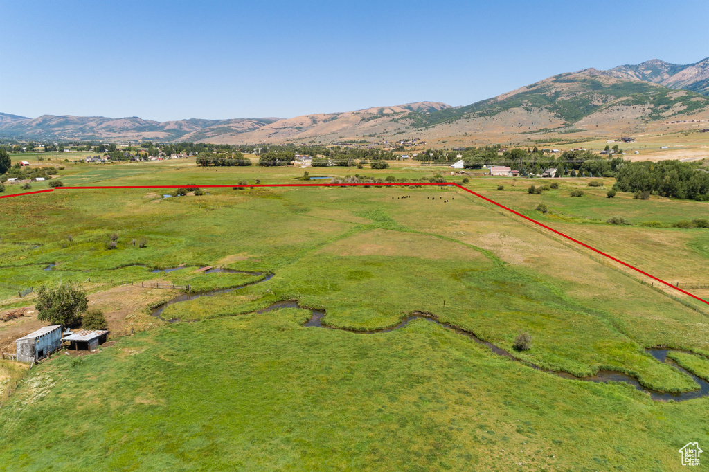 Birds eye view of property with a mountain view and a rural view