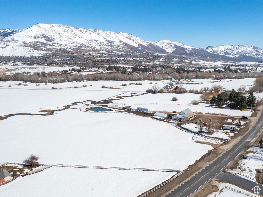 Snowy aerial view featuring a mountain view