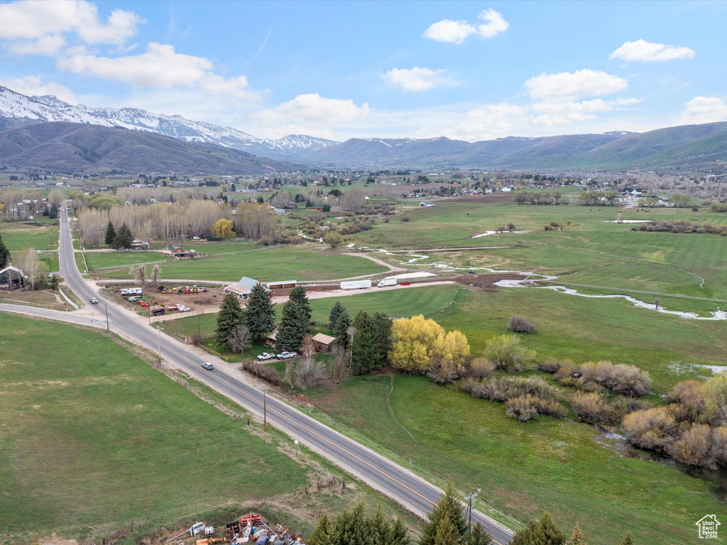 Drone / aerial view with a mountain view and a rural view