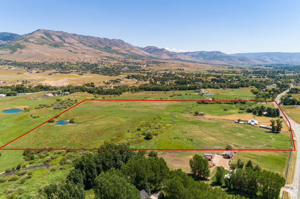 Birds eye view of property featuring a mountain view and a rural view