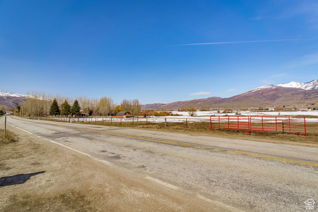 View of street with a rural view and a mountain view