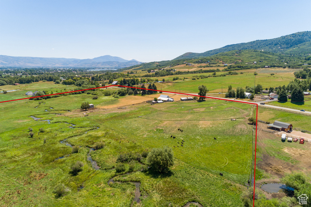 Drone / aerial view with a mountain view and a rural view