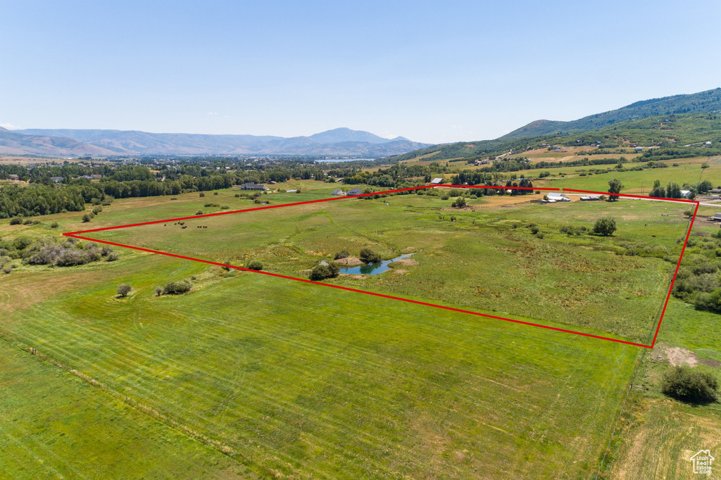Drone / aerial view with a mountain view and a rural view