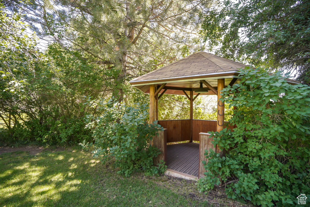 View of yard with a gazebo and a wooden deck