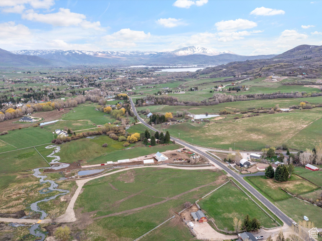 Birds eye view of property featuring a mountain view and a rural view