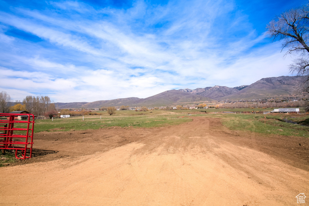 Property view of mountains with a rural view