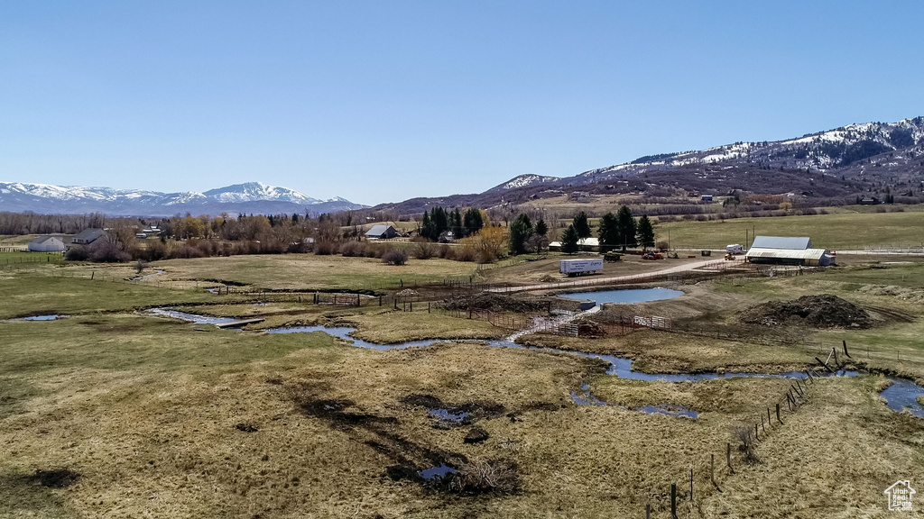 Property view of mountains with a rural view