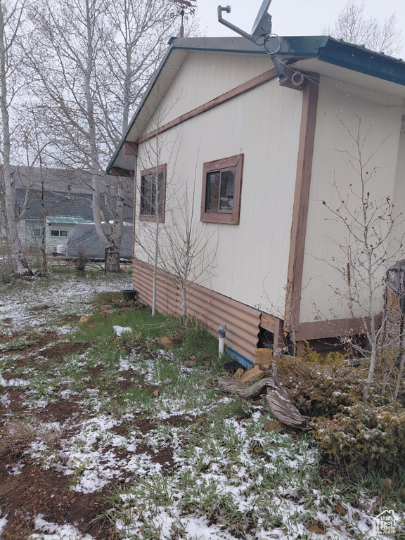 View of snow covered property