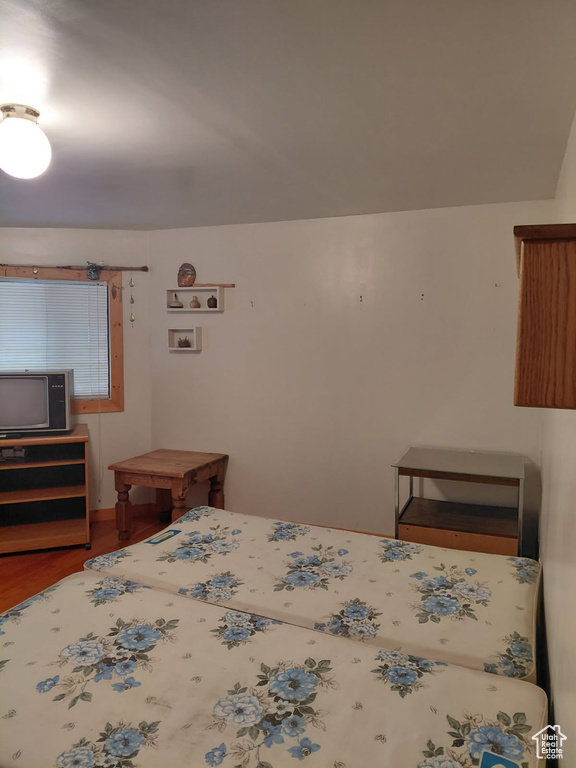 Bedroom featuring wood finished floors