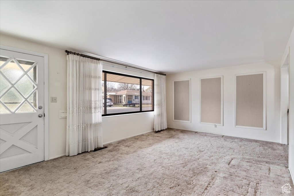 Entrance foyer featuring carpet flooring