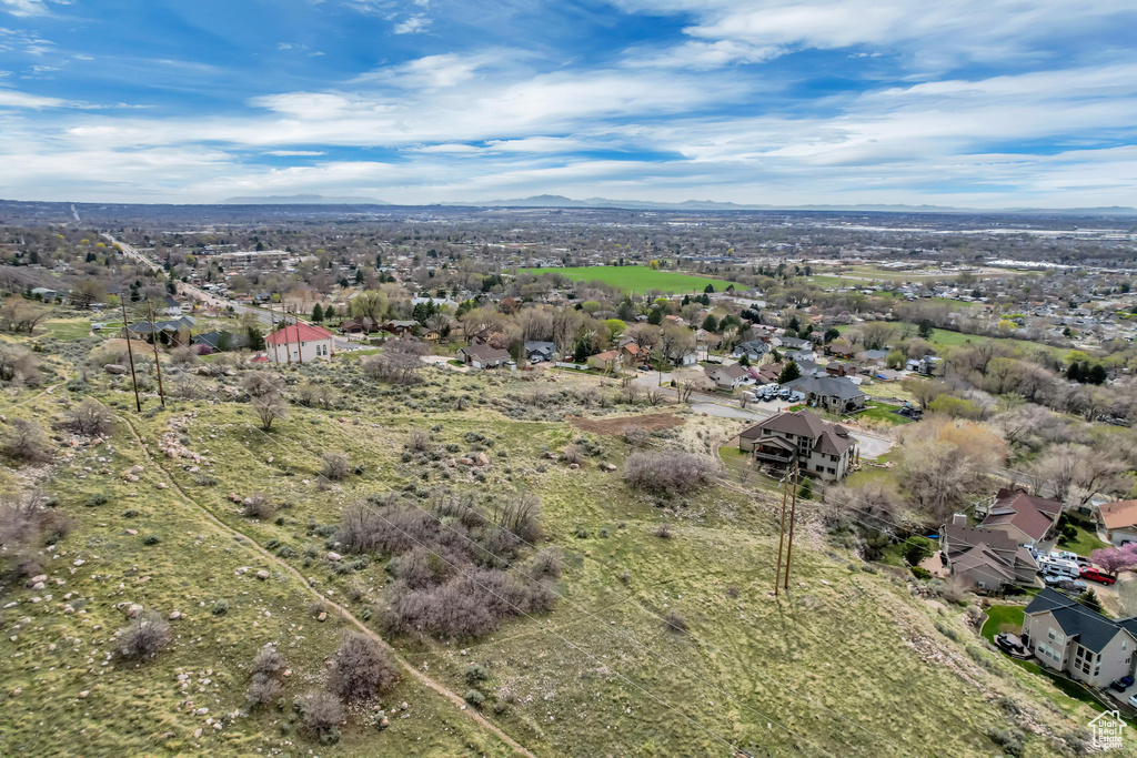Birds eye view of property with a mountain view