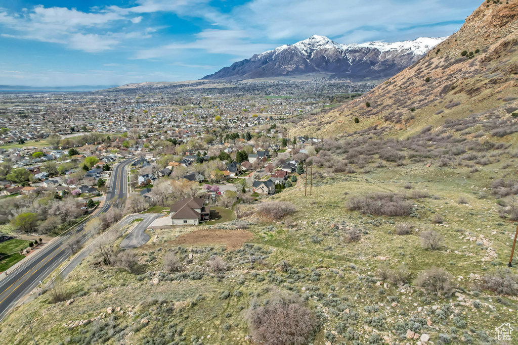 Property view of mountains with a residential view