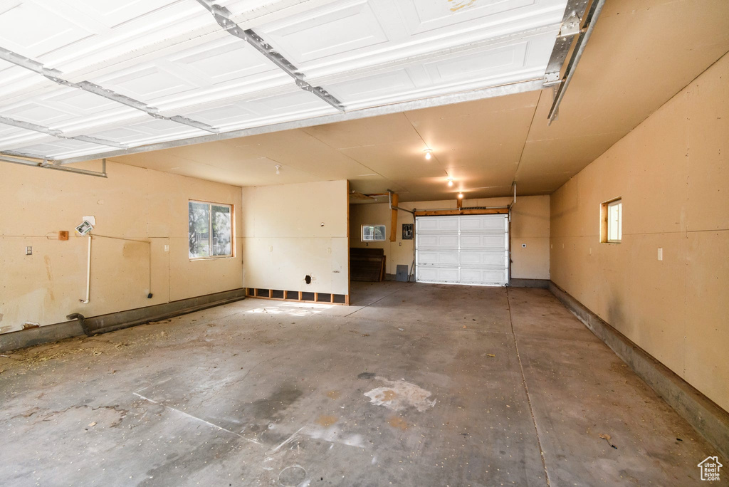 Garage featuring baseboards
