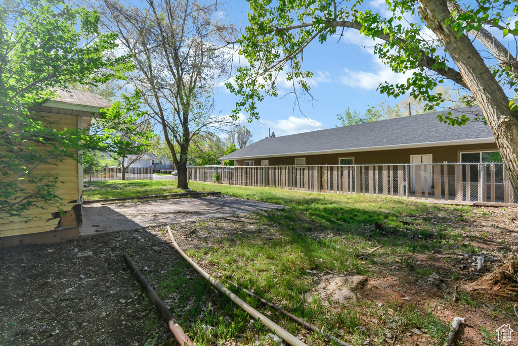 View of yard featuring fence