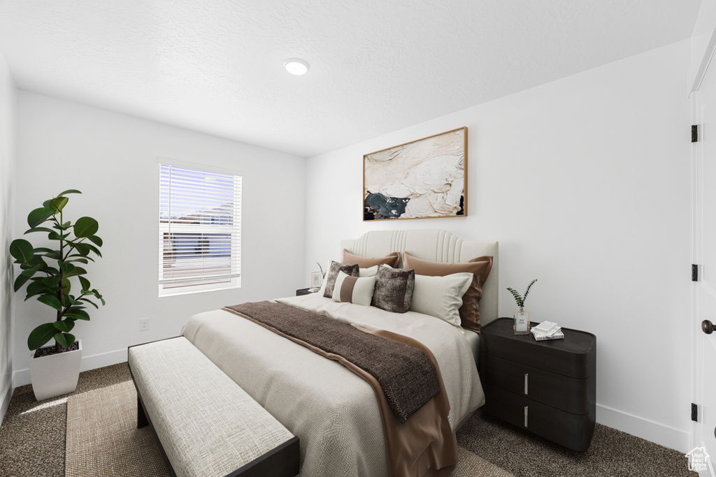 Carpeted bedroom with baseboards