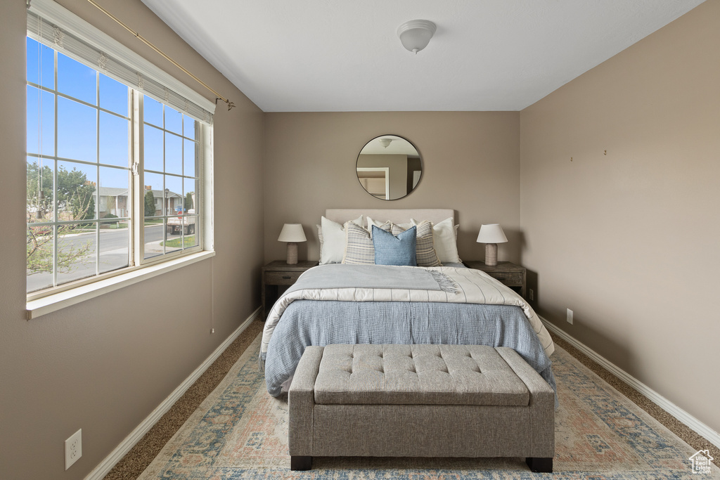 Bedroom with carpet and baseboards