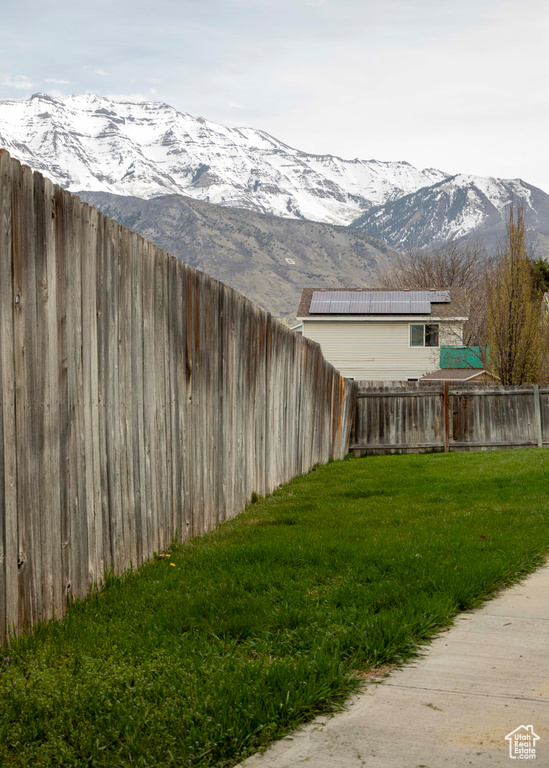 View of yard featuring a mountain view and a fenced backyard