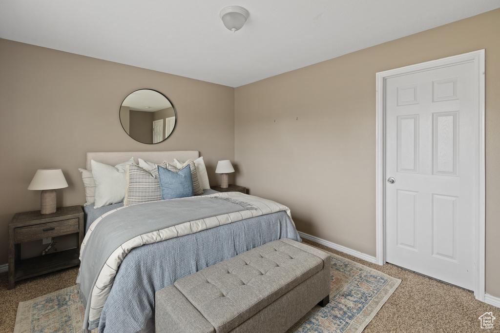 Carpeted bedroom with baseboards