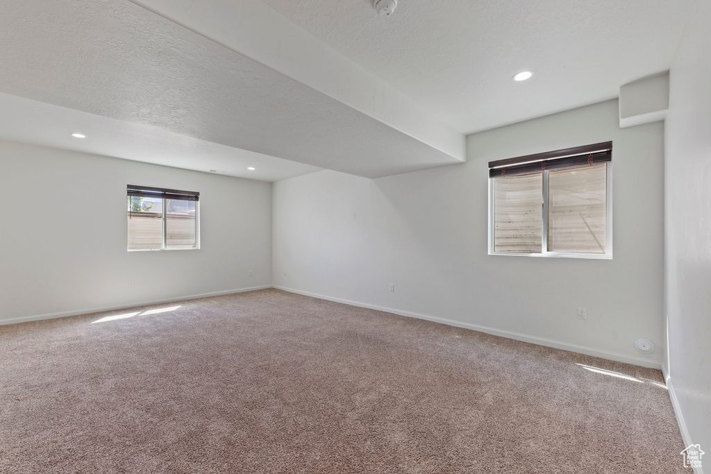 Spare room with baseboards, carpet flooring, and recessed lighting