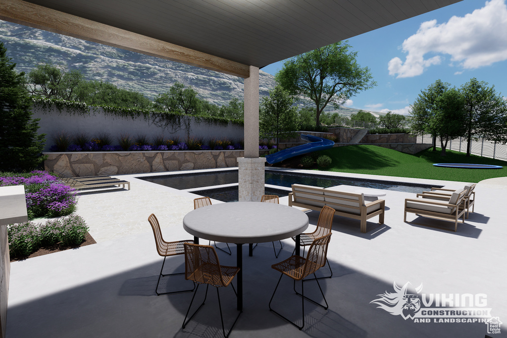 View of patio featuring outdoor dining space and an outdoor living space