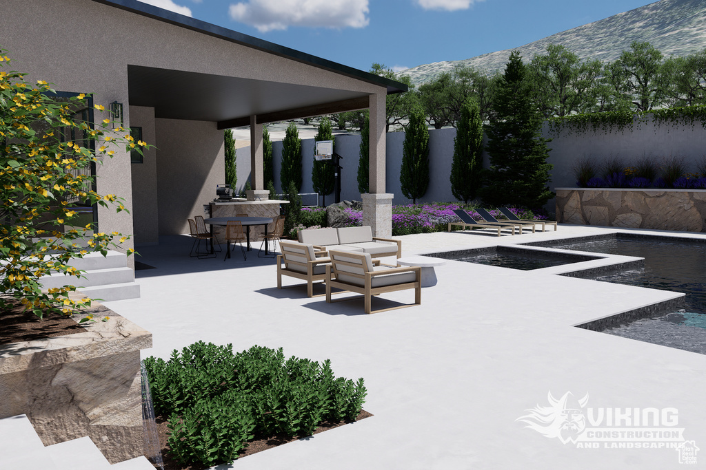 View of patio / terrace featuring outdoor dining area and a mountain view