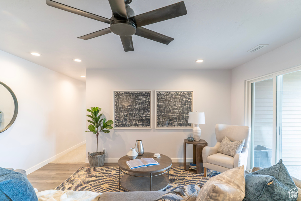 Living area with recessed lighting, baseboards, visible vents, a ceiling fan, and wood finished floors