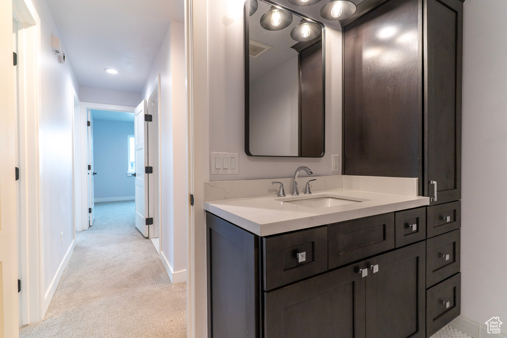 Bathroom featuring vanity and baseboards