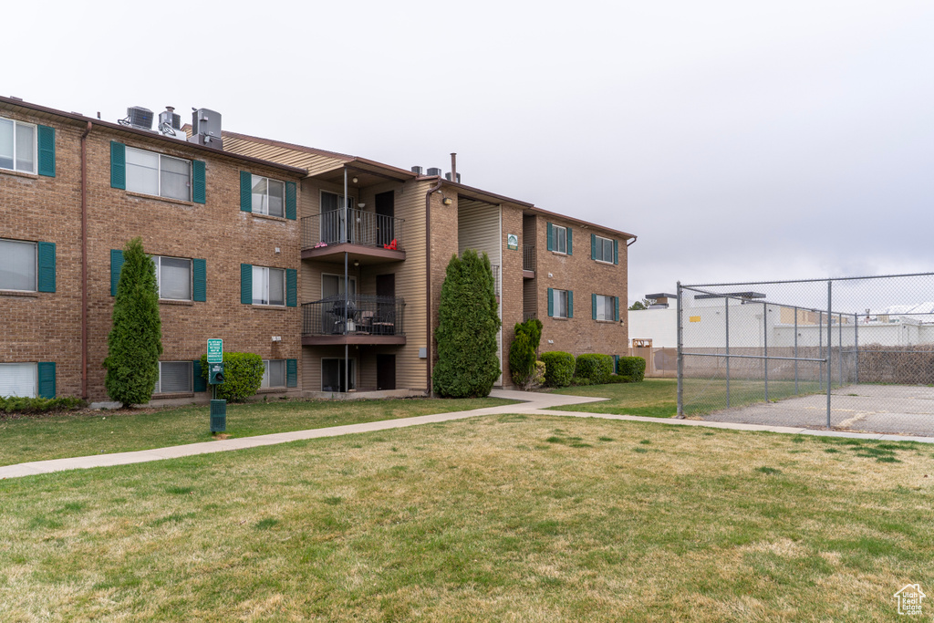 View of property featuring fence