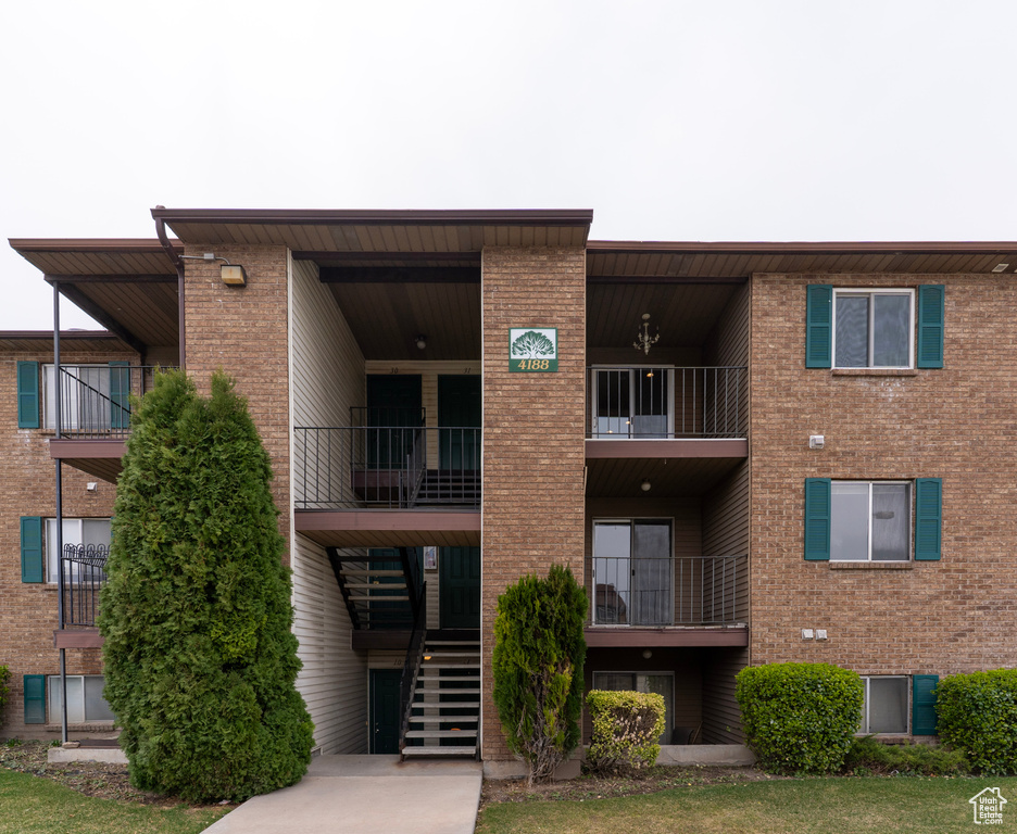 View of property featuring stairway